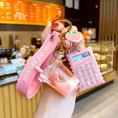 Cute 5-in-1 Keychains with Fur Ball, Paw, Nail Cutter, and Mini Calculator Charms