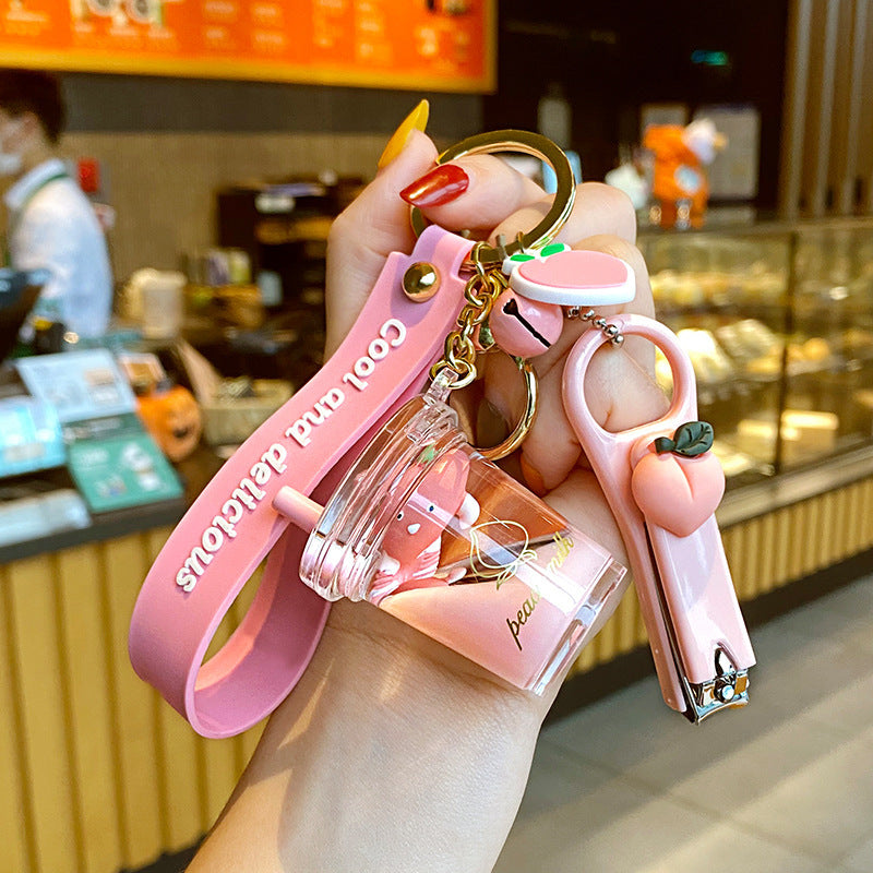 Cute 5-in-1 Keychains with Fur Ball, Paw, Nail Cutter, and Mini Calculator Charms