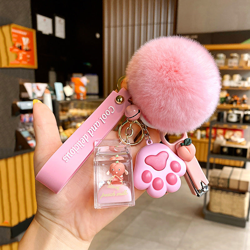 Cute 5-in-1 Keychains with Fur Ball, Paw, Nail Cutter, and Mini Calculator Charms